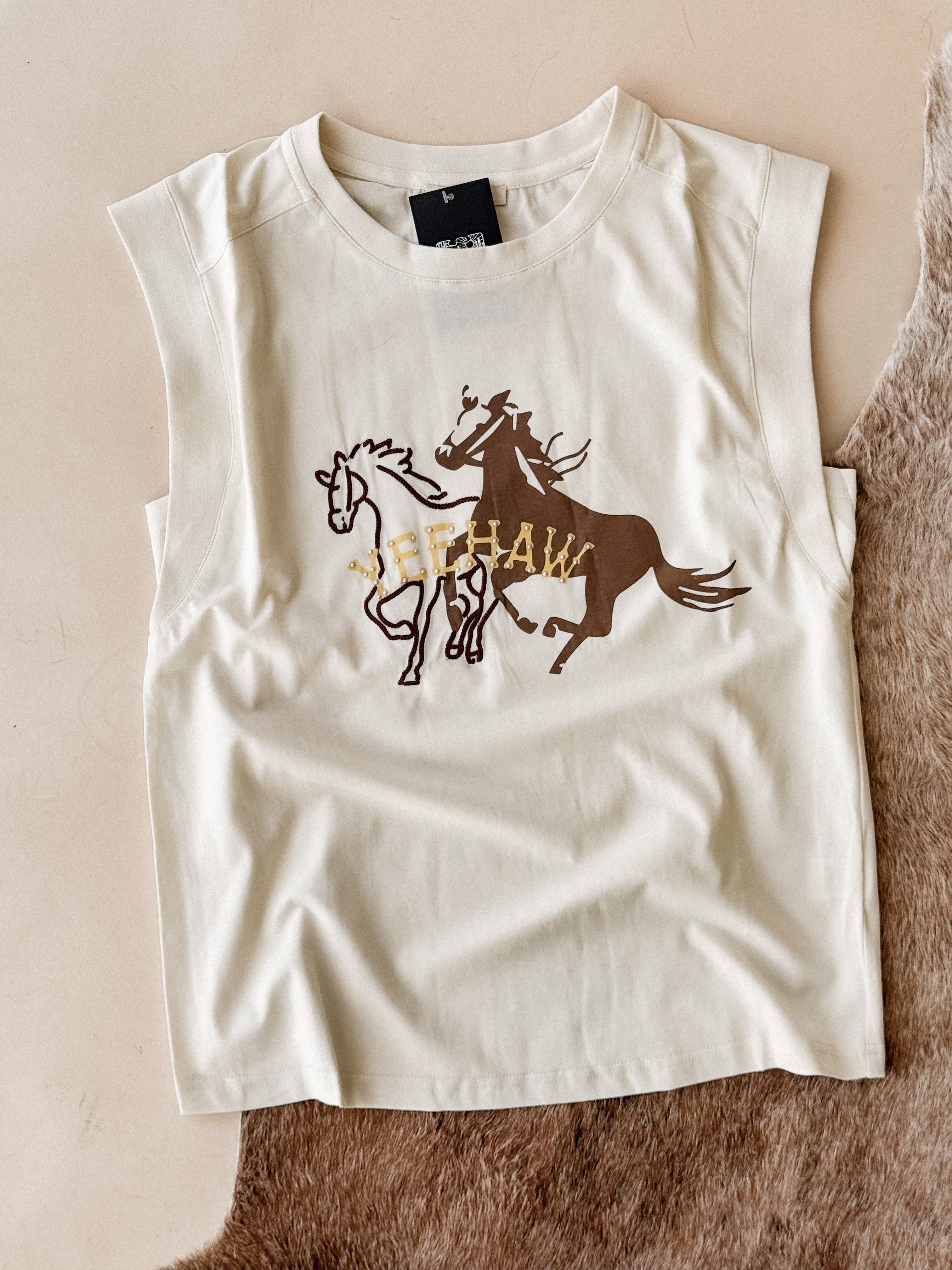 Western graphic sleeveless top with running horses and 'YEEHAW' text on neutral background