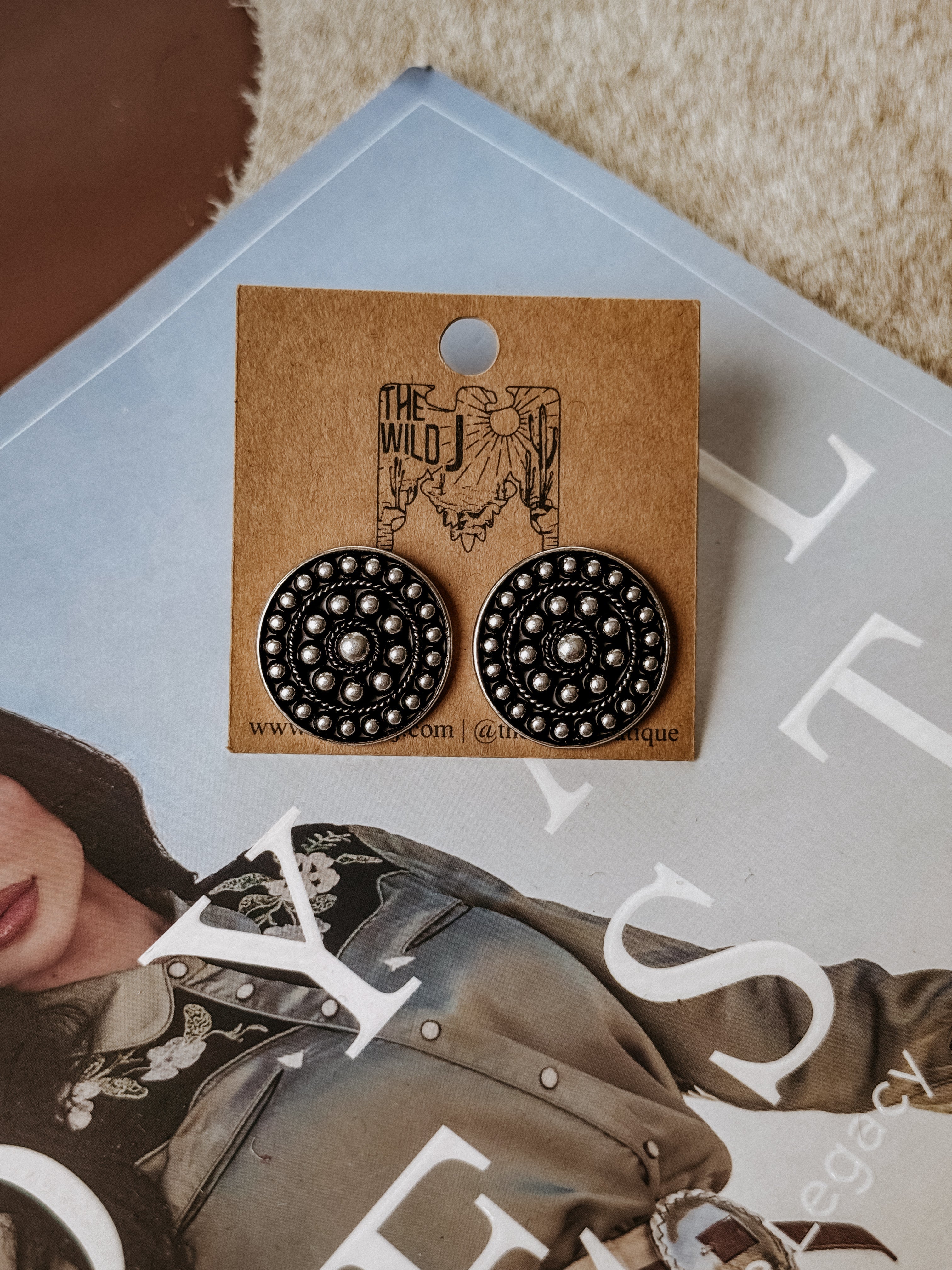 Burnished silver circular concho stud earrings with bubble texture detailing, made from lightweight metal. Post-back style, nickel free