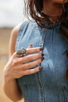 Turquoise western statement ring on woman's hand, denim dress, boho cowgirl style jewelry