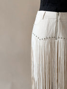 Thunderbird pendant chain necklace displayed on wooden slab with serape fabric underneath - The Wild J