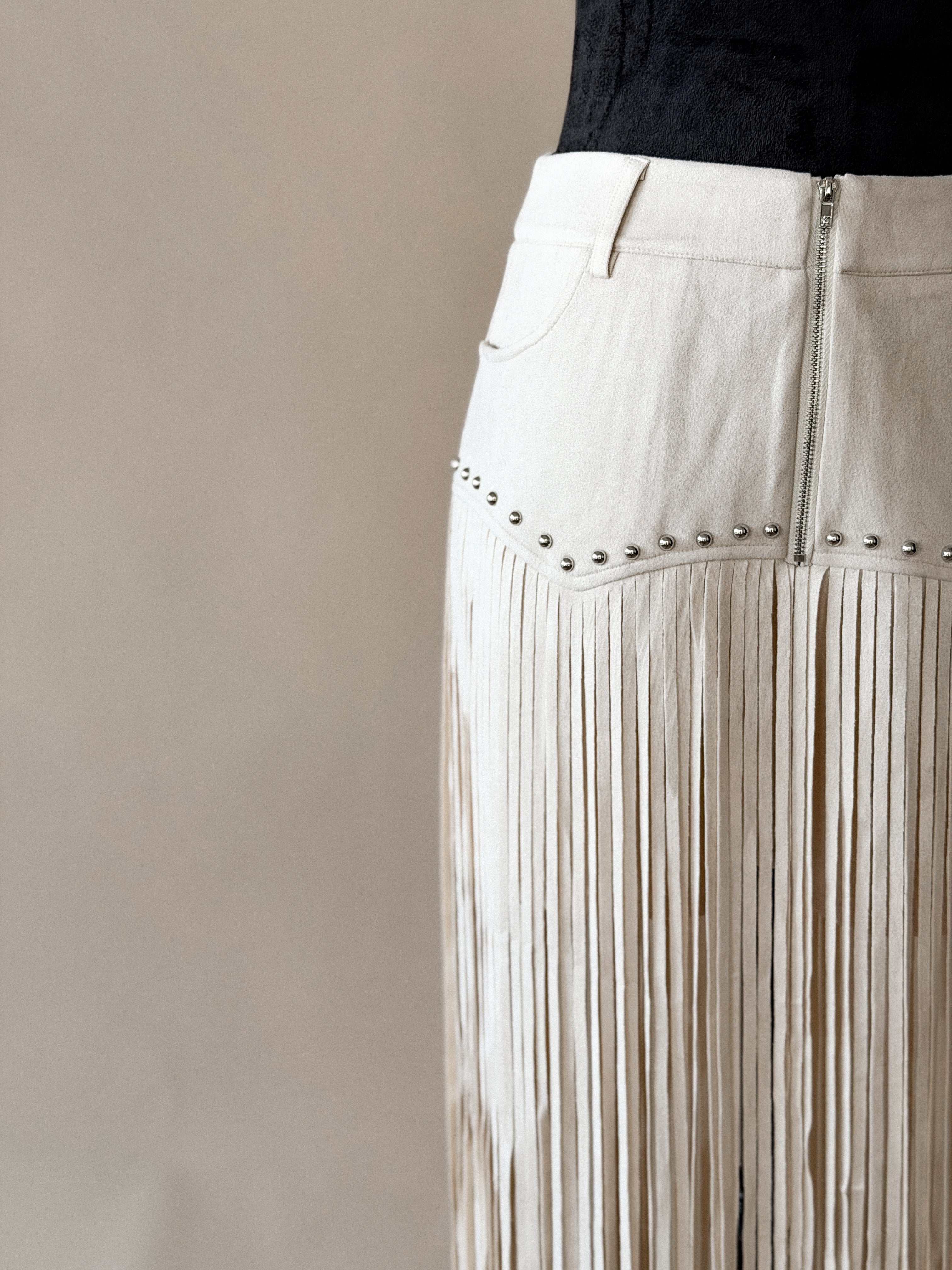 Thunderbird pendant chain necklace displayed on wooden slab with serape fabric underneath - The Wild J