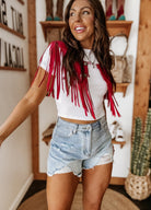 Thunderbird pendant chain necklace displayed on wooden slab with serape fabric underneath - The Wild J