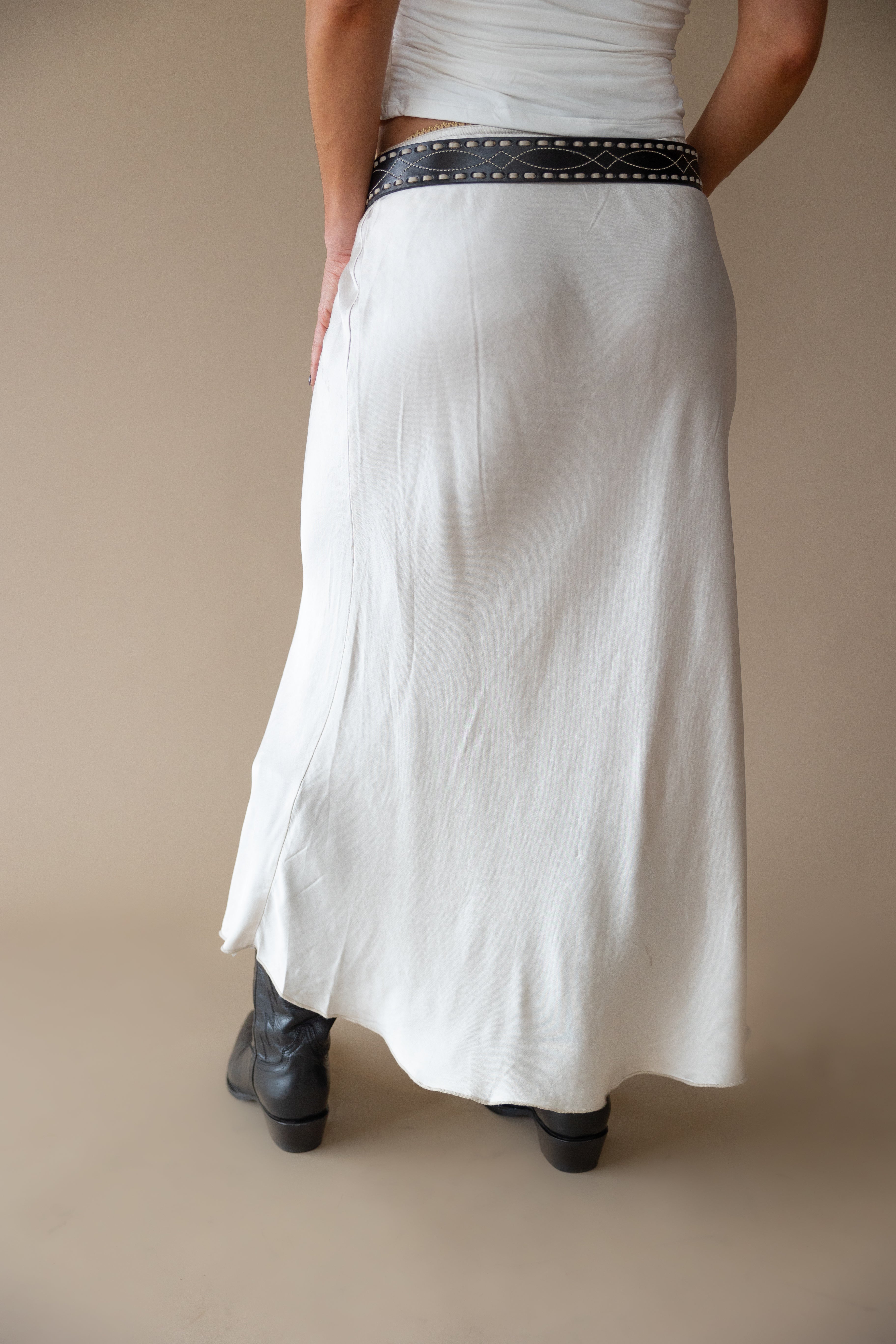 White western maxi skirt with black studded belt and black cowgirl boots