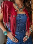 Thunderbird pendant chain necklace displayed on wooden slab with serape fabric underneath - The Wild J