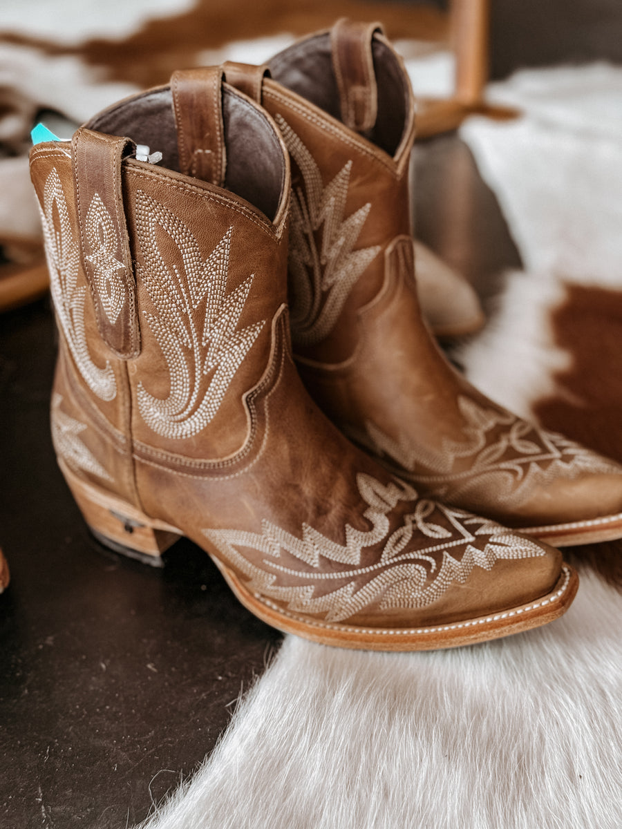 Lane flame stitch ankle bootie with snip toe and turquoise sole