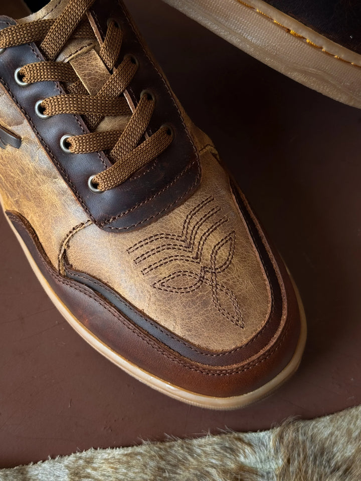 Brown leather western sneaker with stitched toe design, western boho footwear detail