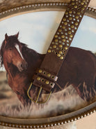 Thunderbird pendant chain necklace displayed on wooden slab with serape fabric underneath - The Wild J