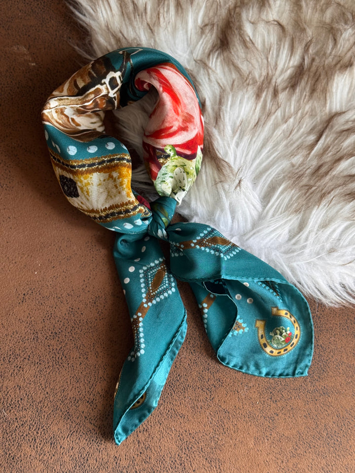 Colorful patterned scarf on a textured surface with fur background