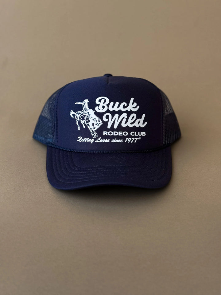 Navy blue western trucker hat with rodeo rider graphic and Buck Wild Rodeo Club text on front