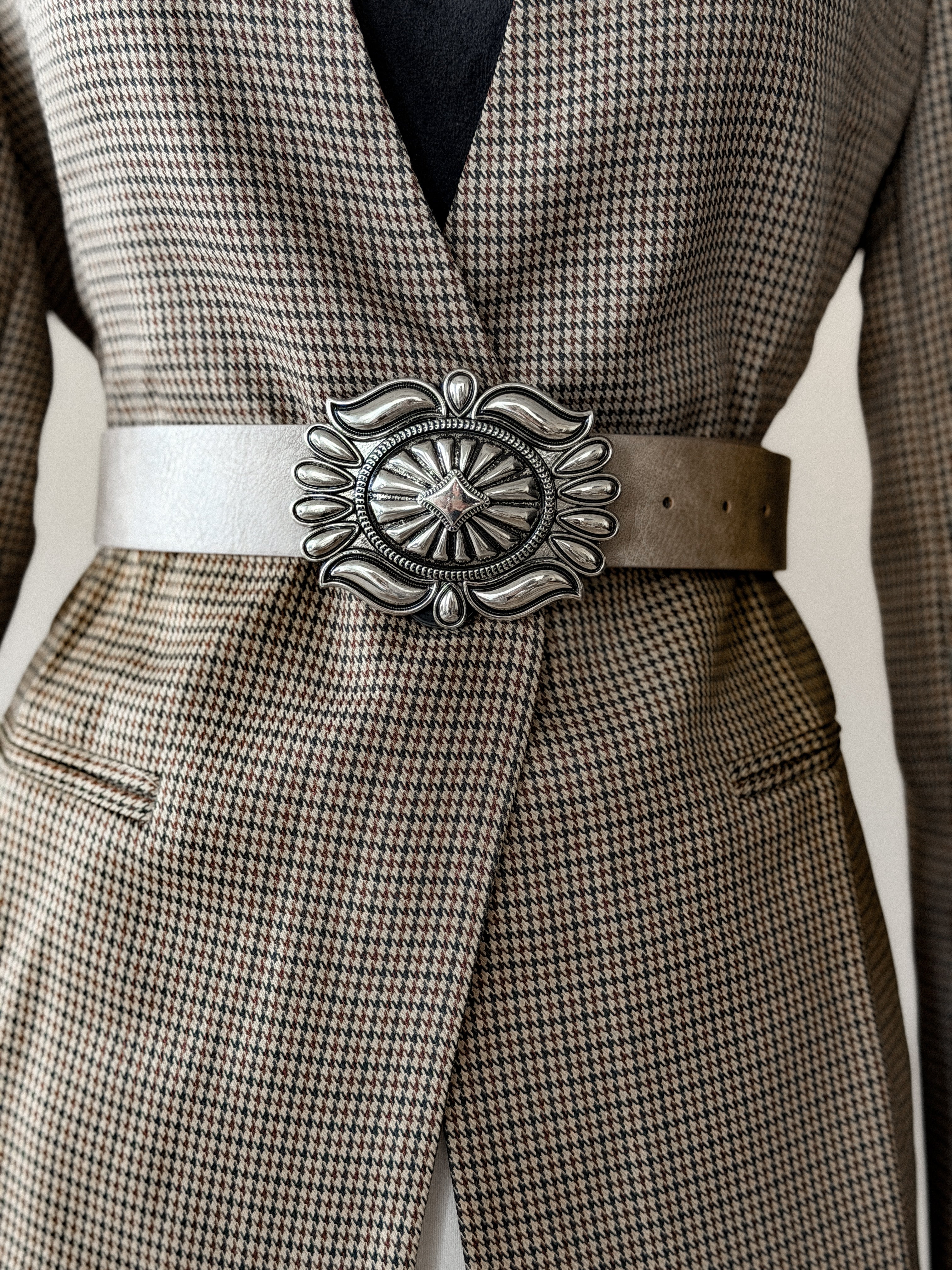 Thunderbird pendant chain necklace displayed on wooden slab with serape fabric underneath - The Wild J