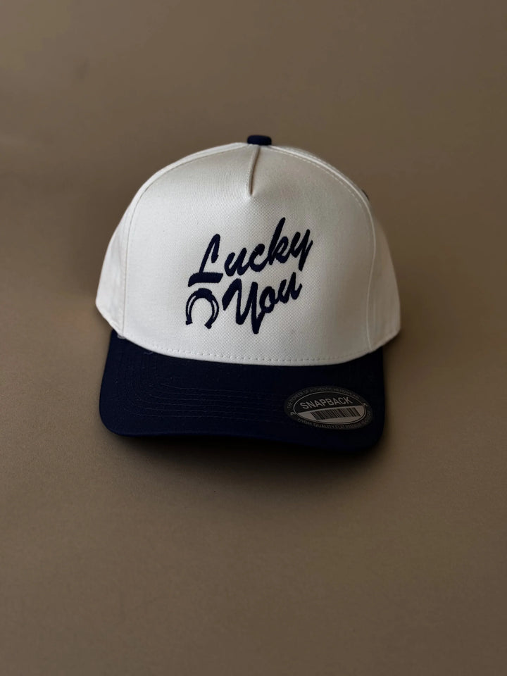 White and navy western snapback hat with &
