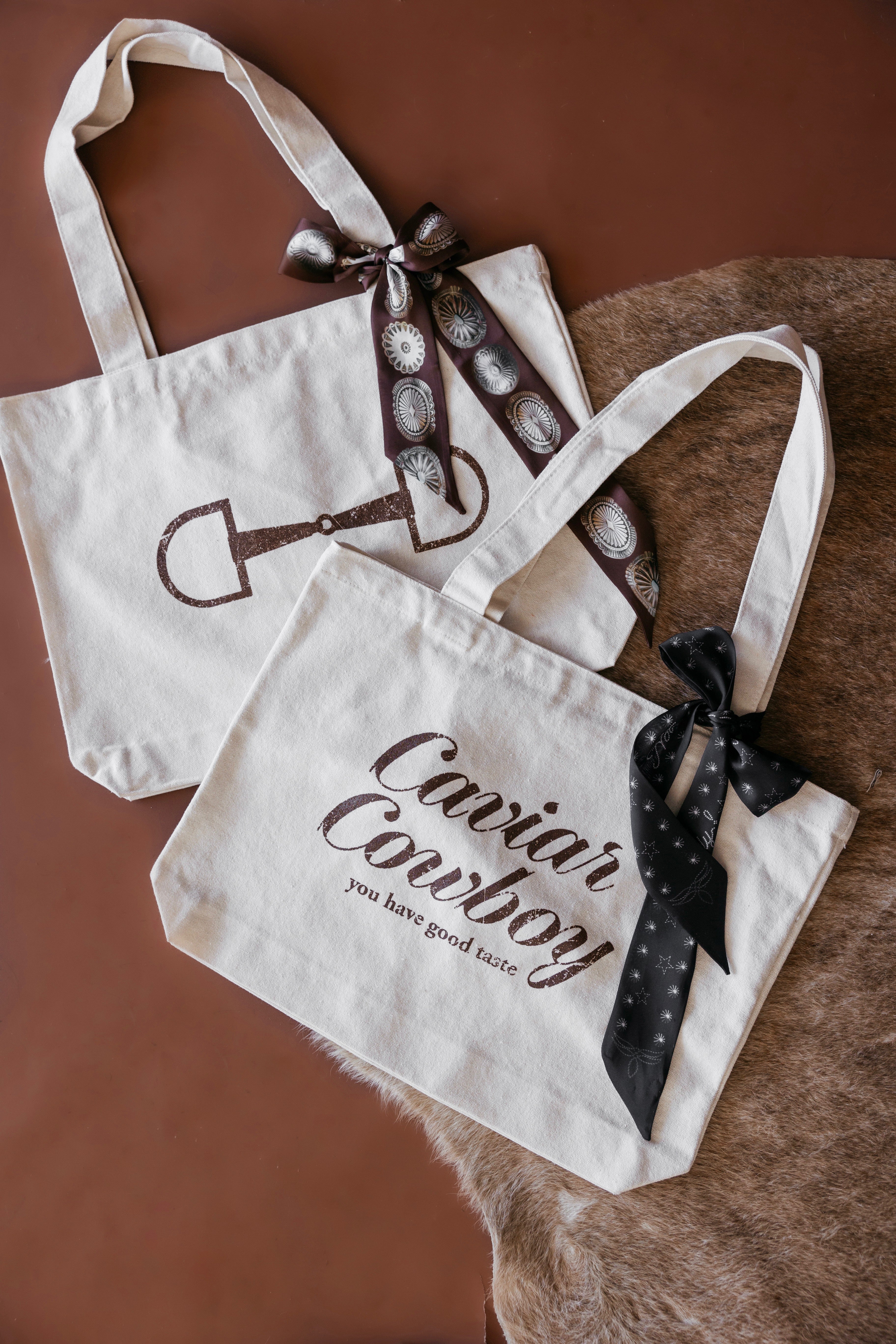 Thunderbird pendant chain necklace displayed on wooden slab with serape fabric underneath - The Wild J