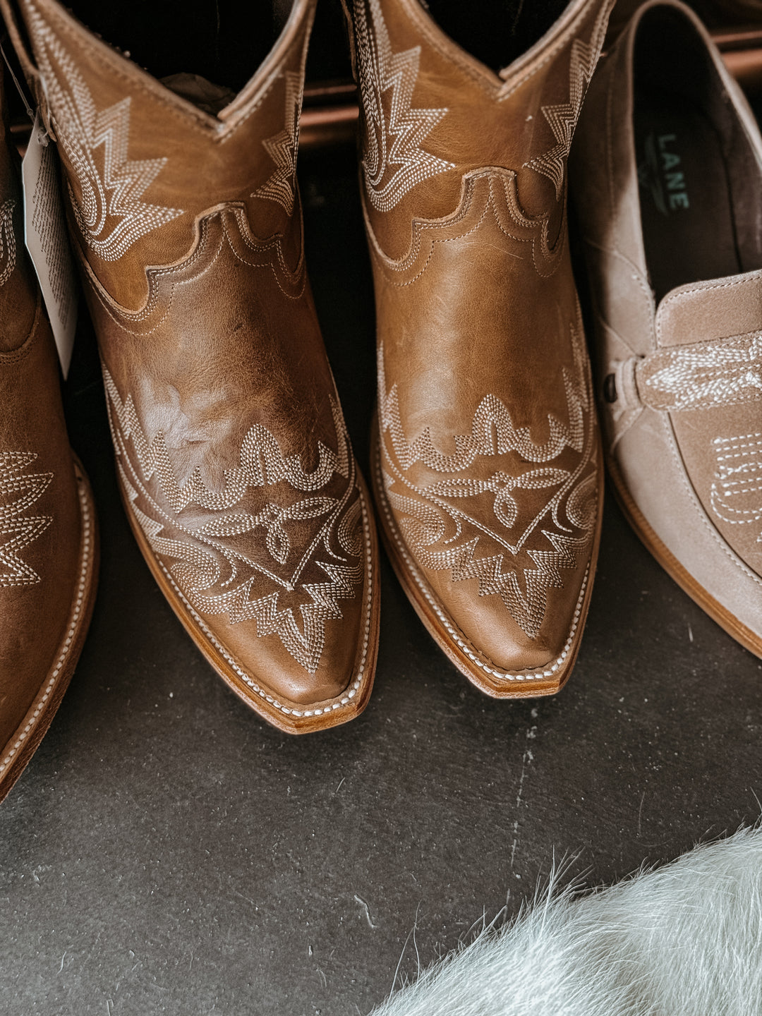 Lane flame stitch ankle bootie with snip toe and turquoise sole