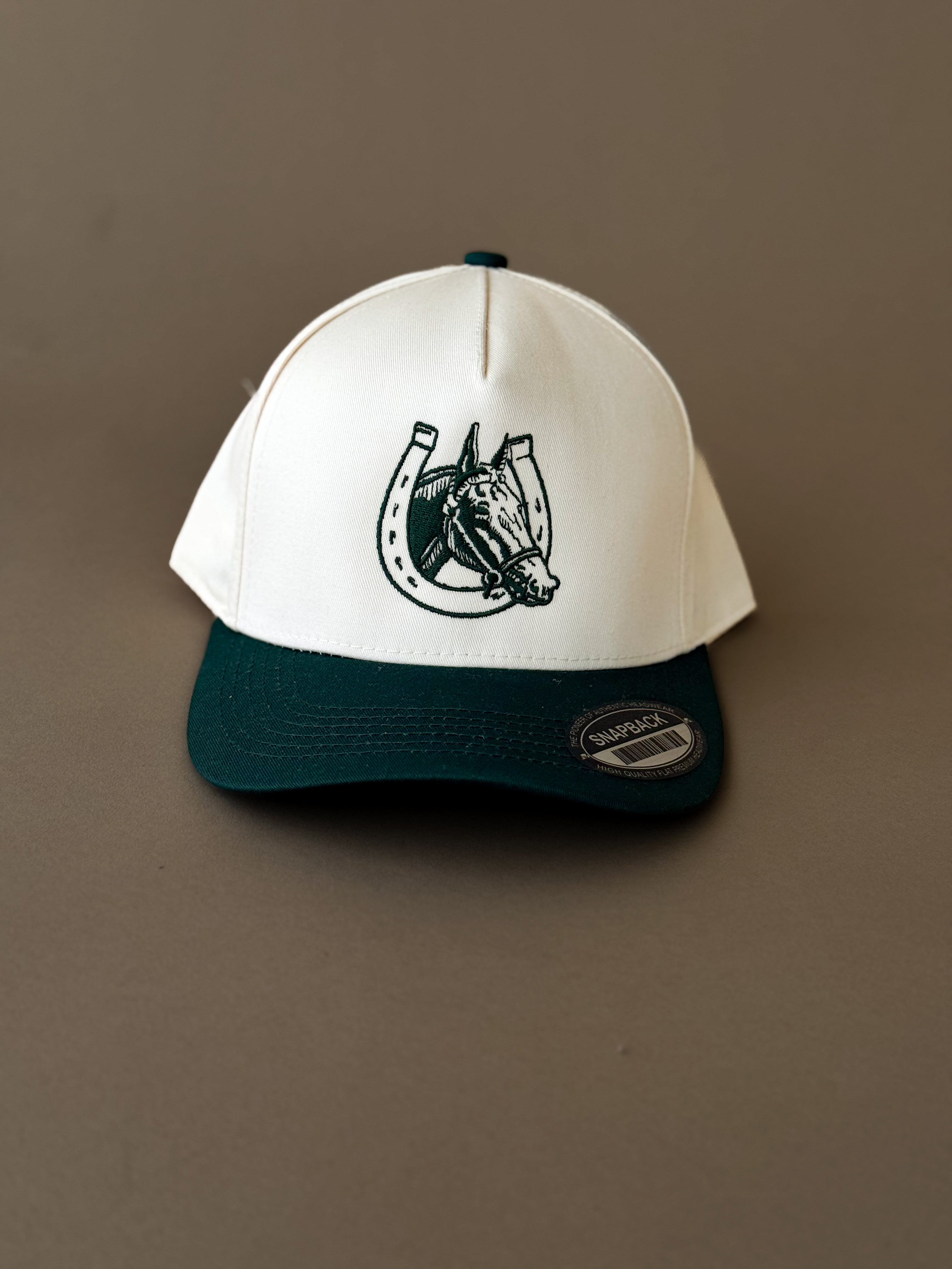 Western snapback hat with horse and horseshoe embroidery, two-tone green and white design