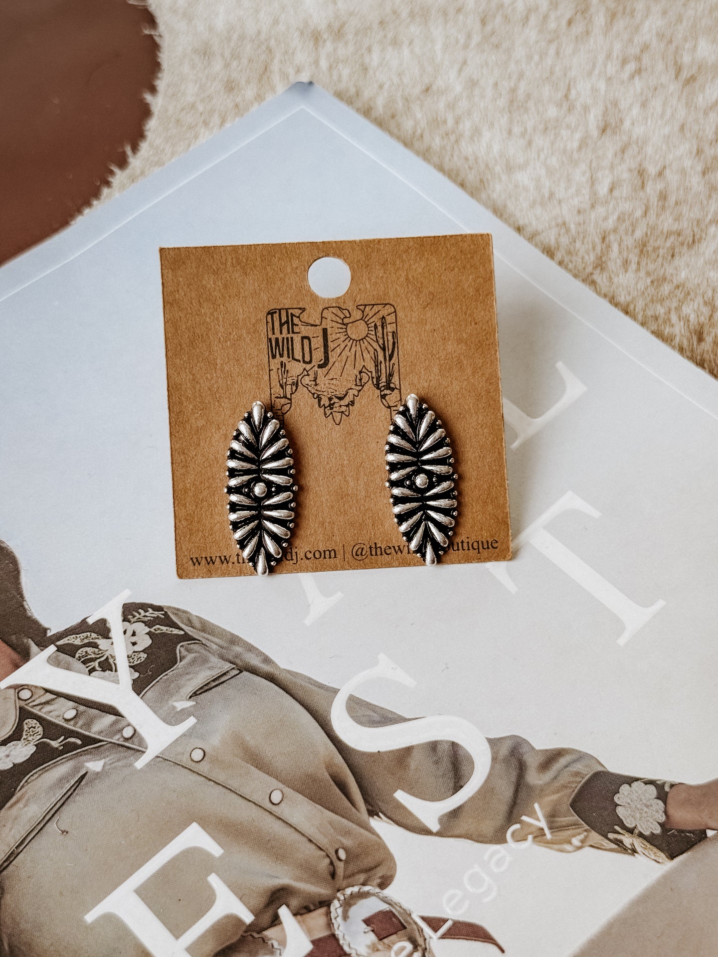 Burnished silver teardrop earrings featuring a  burst engraving and lightweight stud backing