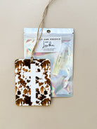 Thunderbird pendant chain necklace displayed on wooden slab with serape fabric underneath - The Wild J