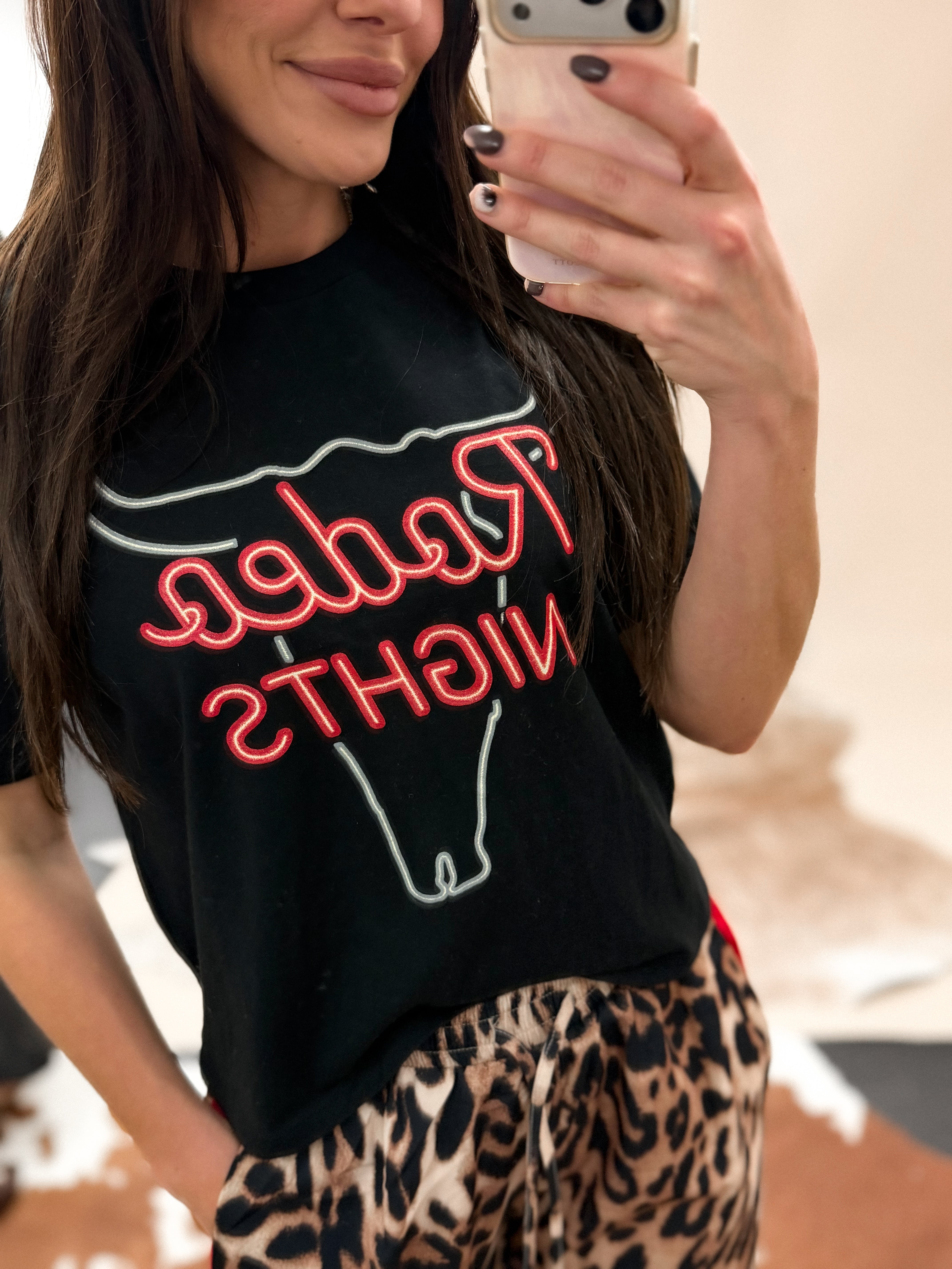 Thunderbird pendant chain necklace displayed on wooden slab with serape fabric underneath - The Wild J