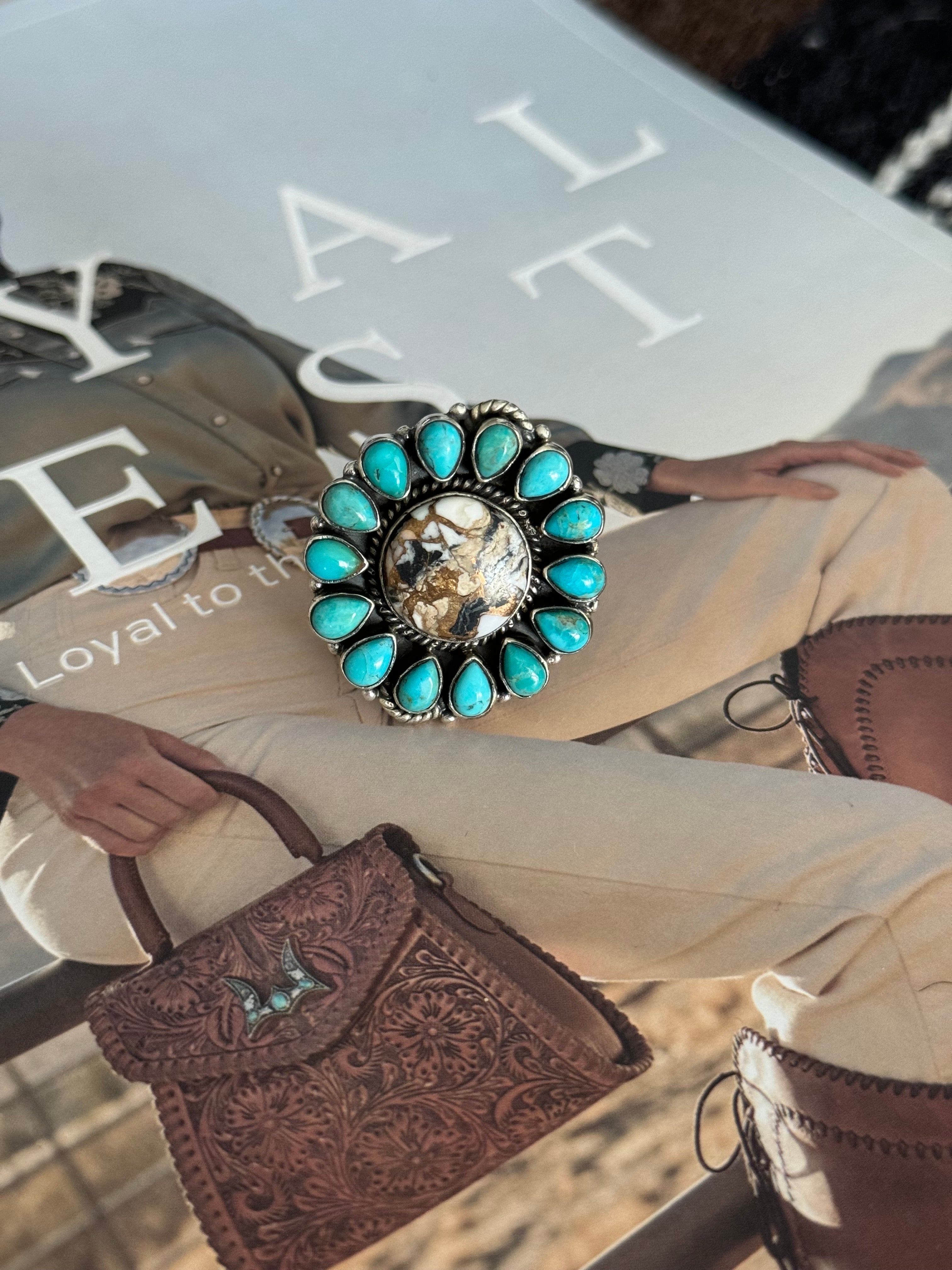 Western boho turquoise statement ring with engraved center stone on fashion magazine