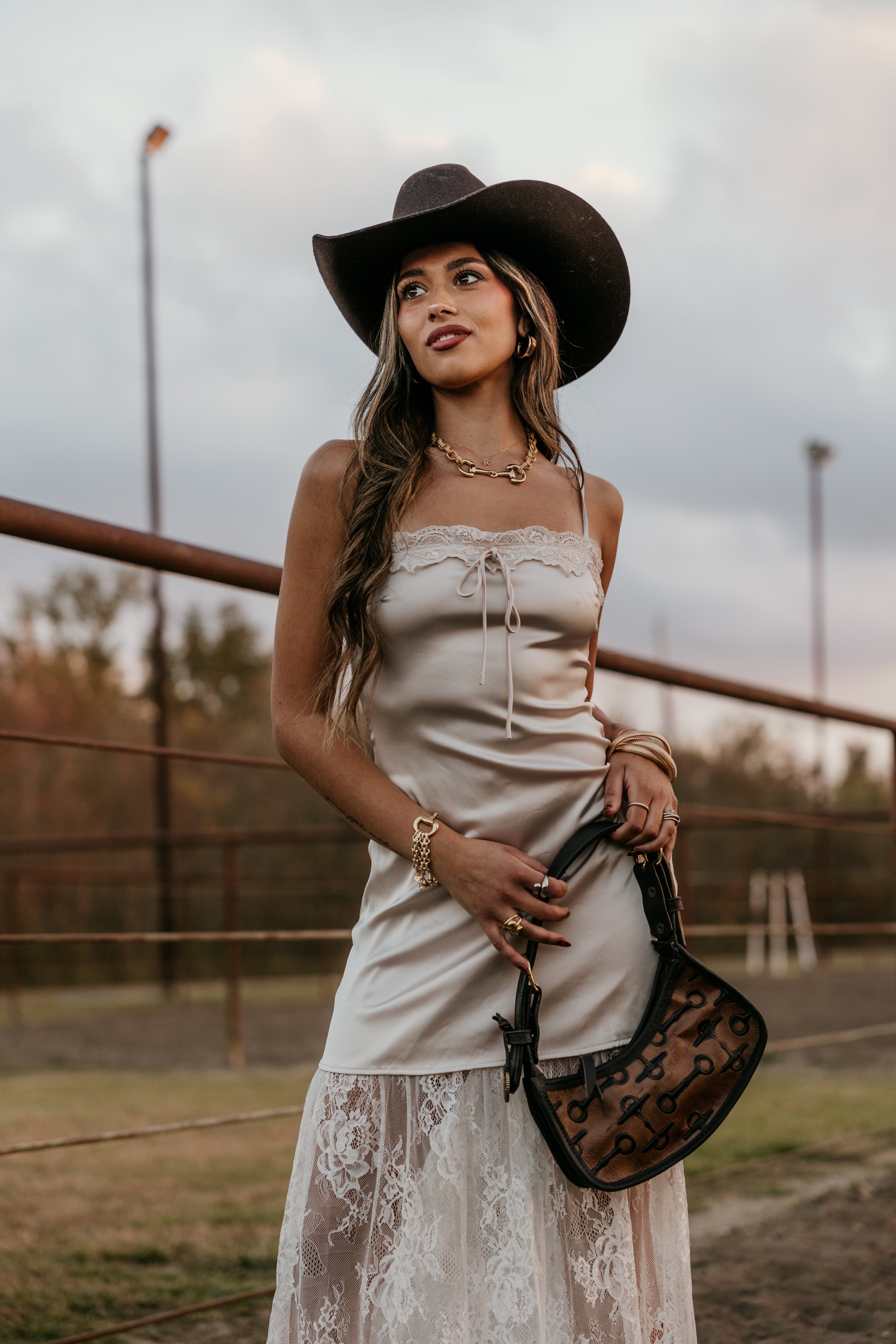 Thunderbird pendant chain necklace displayed on wooden slab with serape fabric underneath - The Wild J