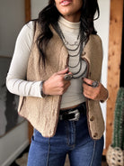 Thunderbird pendant chain necklace displayed on wooden slab with serape fabric underneath - The Wild J