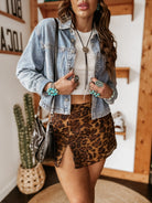 Thunderbird pendant chain necklace displayed on wooden slab with serape fabric underneath - The Wild J