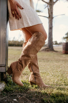 Thunderbird pendant chain necklace displayed on wooden slab with serape fabric underneath - The Wild J