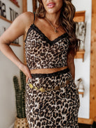 Thunderbird pendant chain necklace displayed on wooden slab with serape fabric underneath - The Wild J