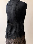 Black lace trim camisole top with spaghetti straps and leopard print skirt on mannequin
