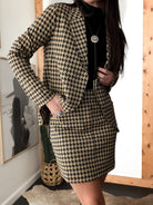 Thunderbird pendant chain necklace displayed on wooden slab with serape fabric underneath - The Wild J