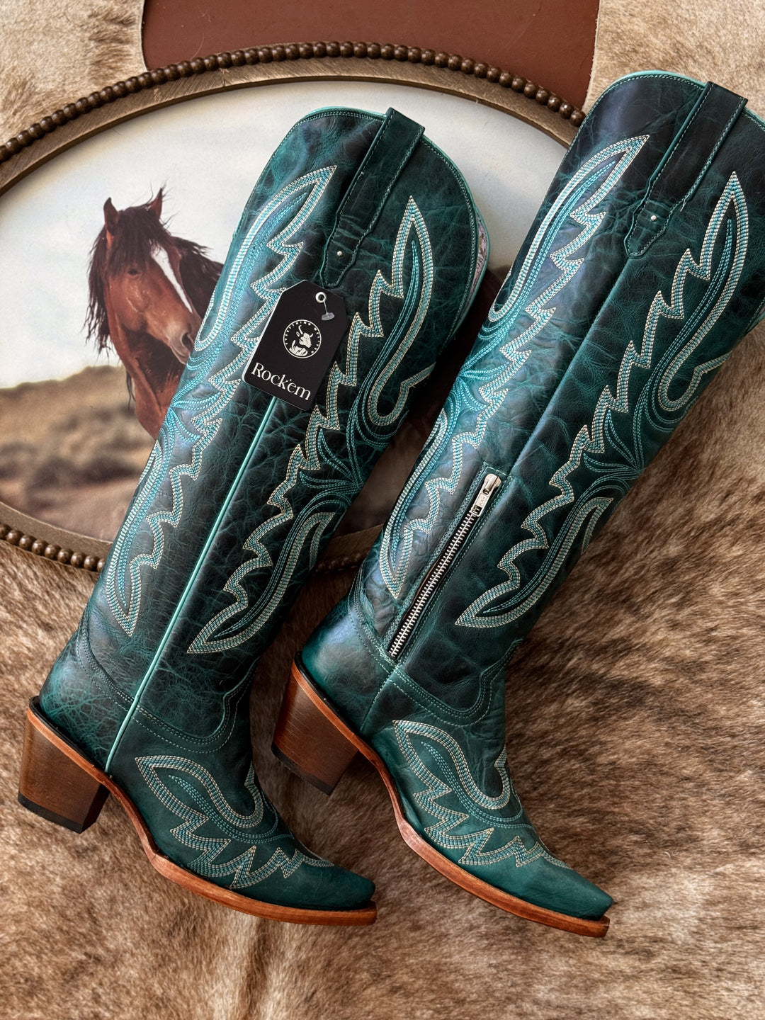 teal turquoise cowboy boots with white stitching