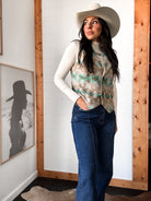 Thunderbird pendant chain necklace displayed on wooden slab with serape fabric underneath - The Wild J