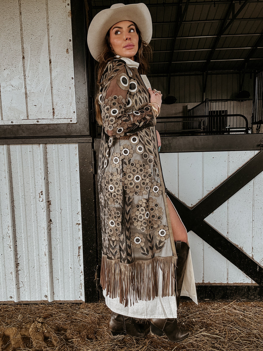 black and gold cardigan with fringe and floral appliqué