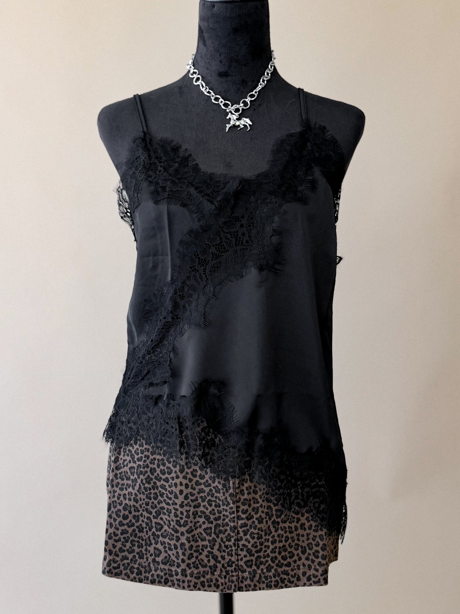 Black lace asymmetrical low-back cami styled with western accessories