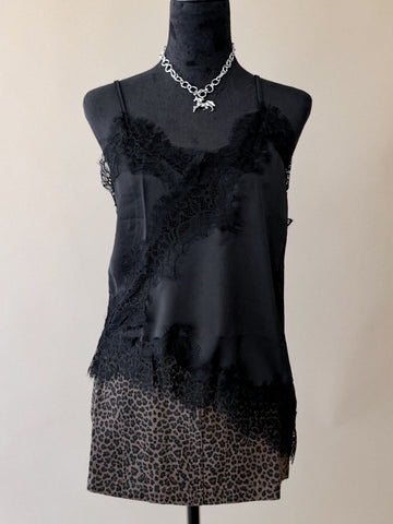 Black lace asymmetrical low-back cami styled with western accessories