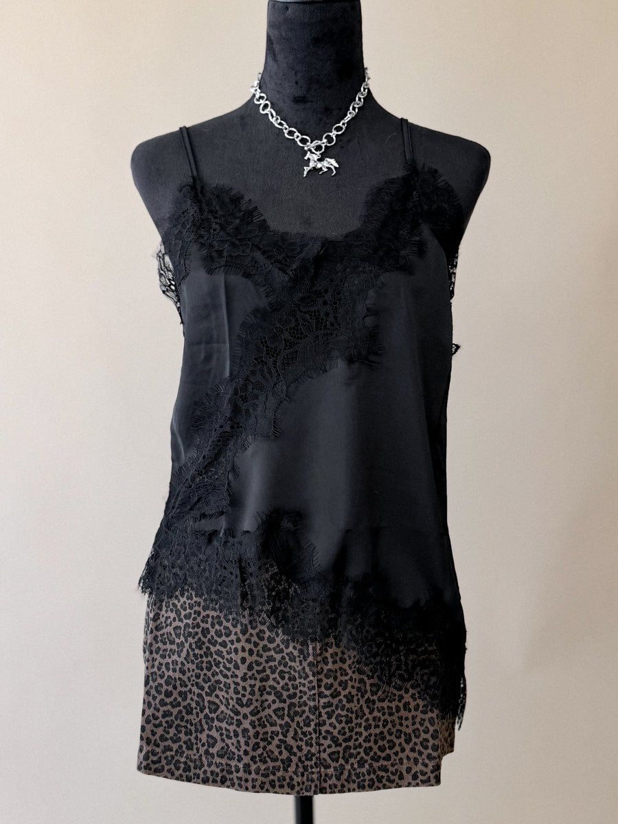 Black lace asymmetrical low-back cami styled with western accessories