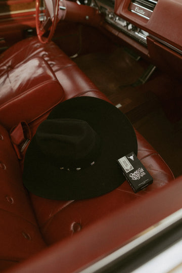 black cowboy hat with Cadillac Cowgirl perfume