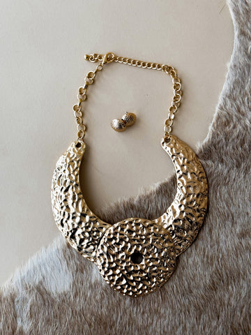 Hammered gold panel necklace with textured western statement design
