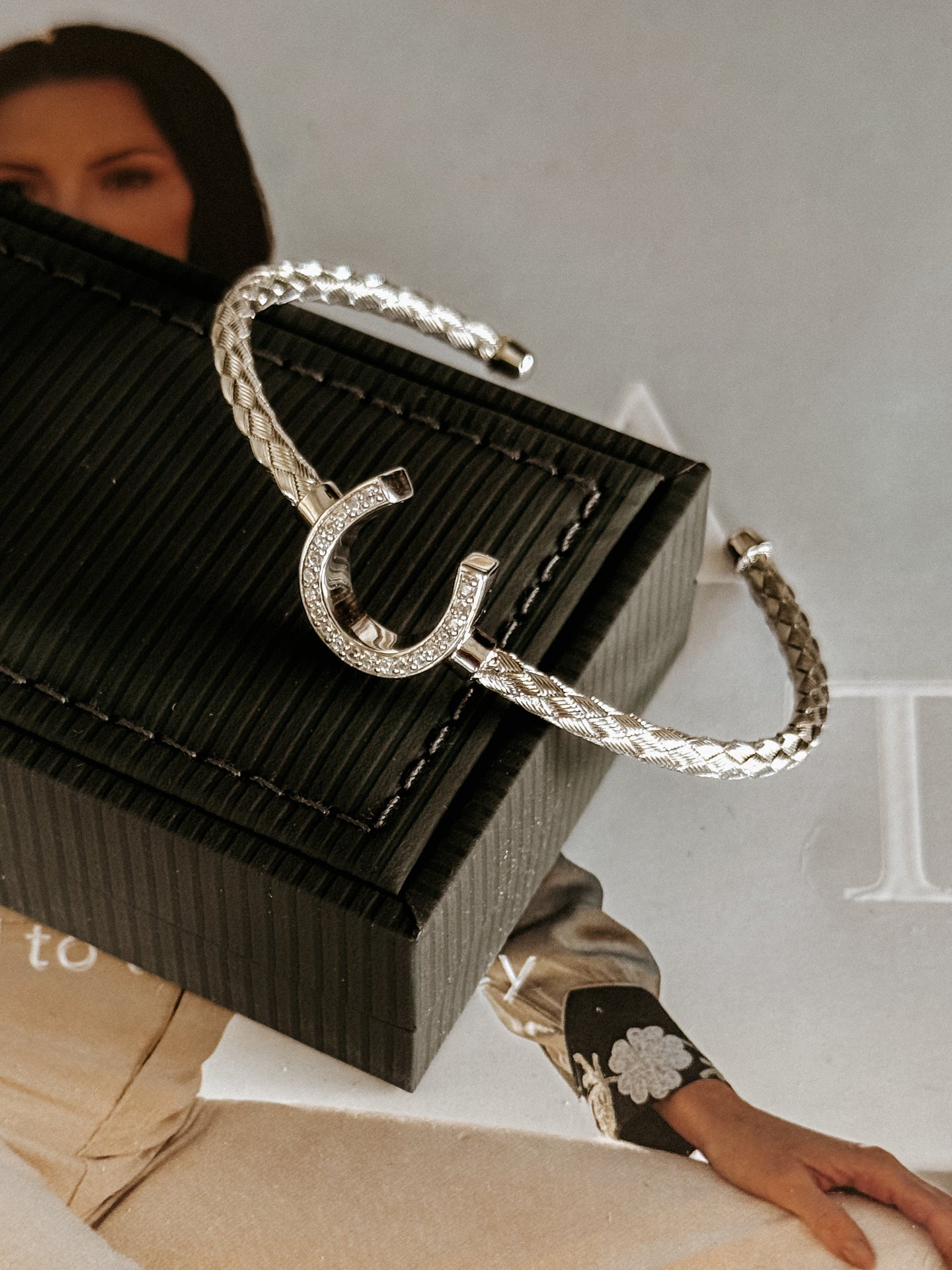 Close-up of pavé cubic zirconia horseshoe bracelet