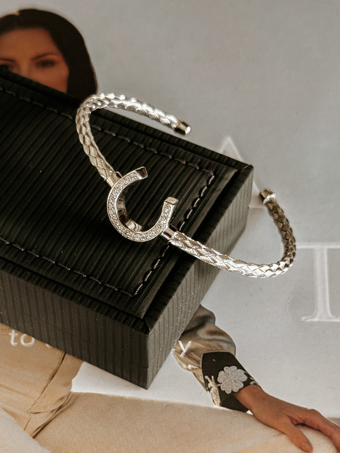Close-up of pavé cubic zirconia horseshoe bracelet