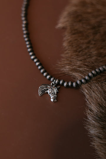 Western beaded horse charm necklace close-up