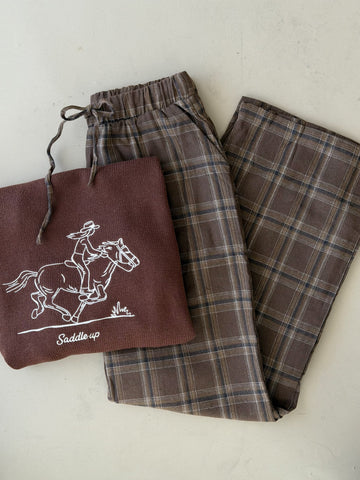 Dusty brown plaid wide-leg pajama pants shown folded