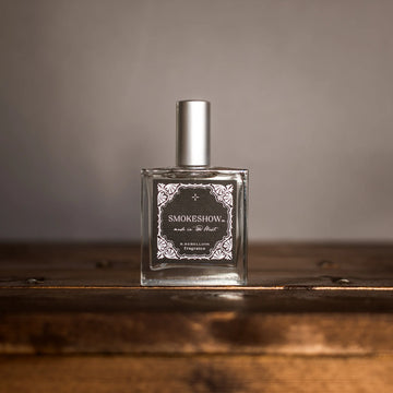 Smokeshow perfume bottle with western-inspired label on neutral background