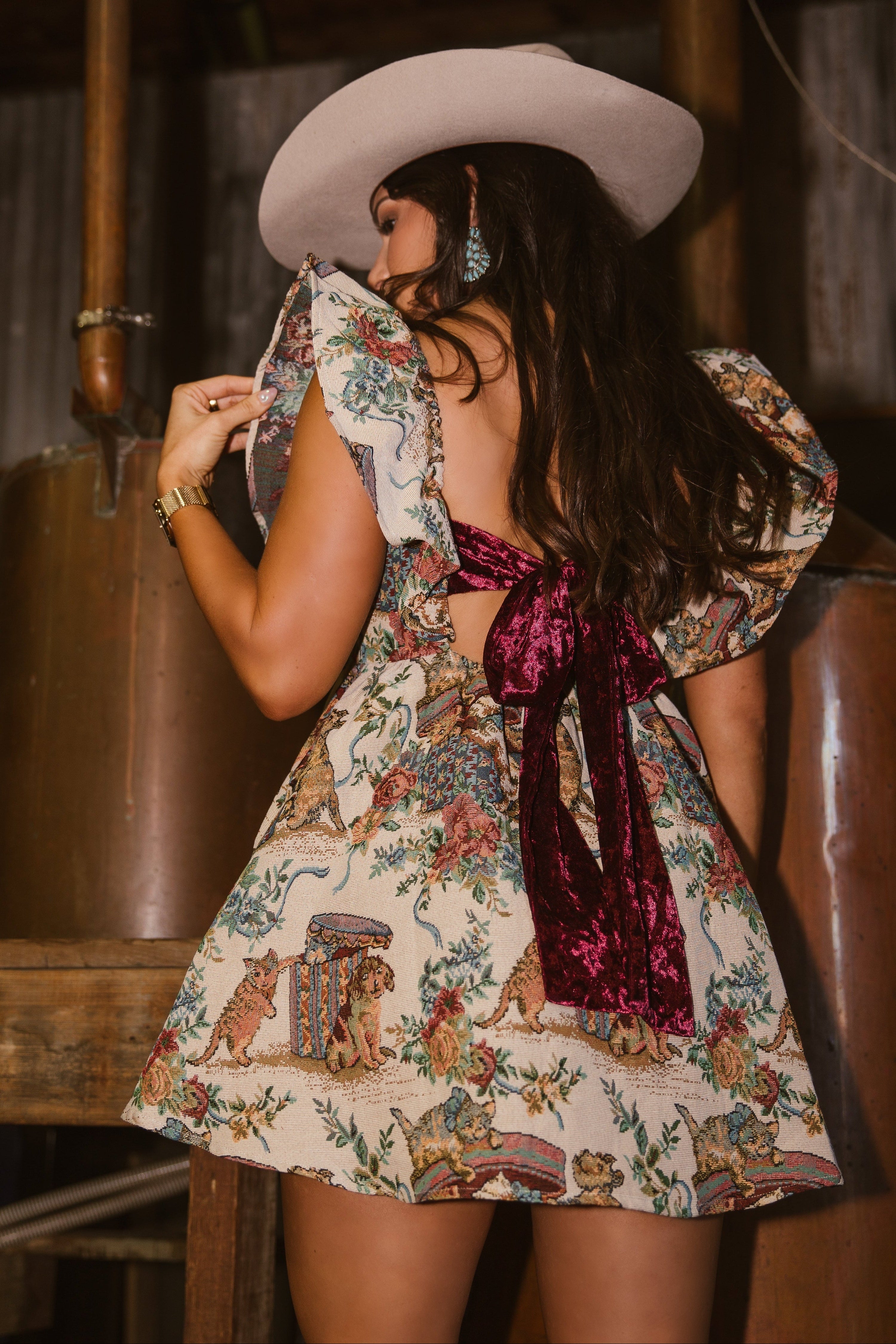 velvet ribbon mini dress with red velvet bow showing on back and jacquard fabric