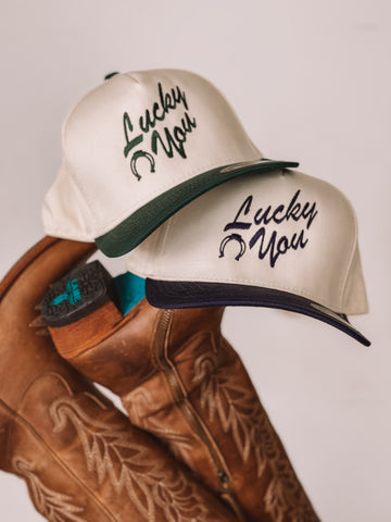 Navy and Green Lucky You Women’s trucker hats with horseshoe embroidery