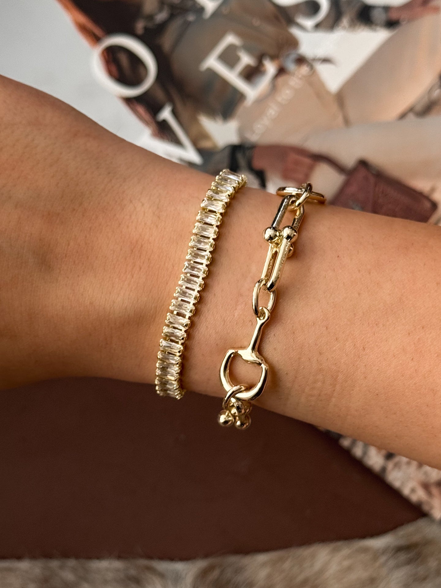 western gold adjustable bracelet with emerald cut cubic zirconia stones