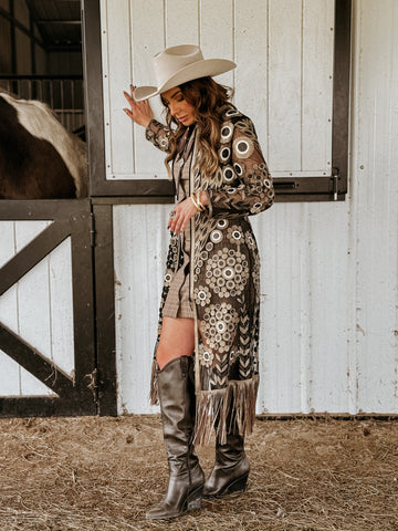 cute Saints game outfit. black and gold cardigan with cowboy hat and boots